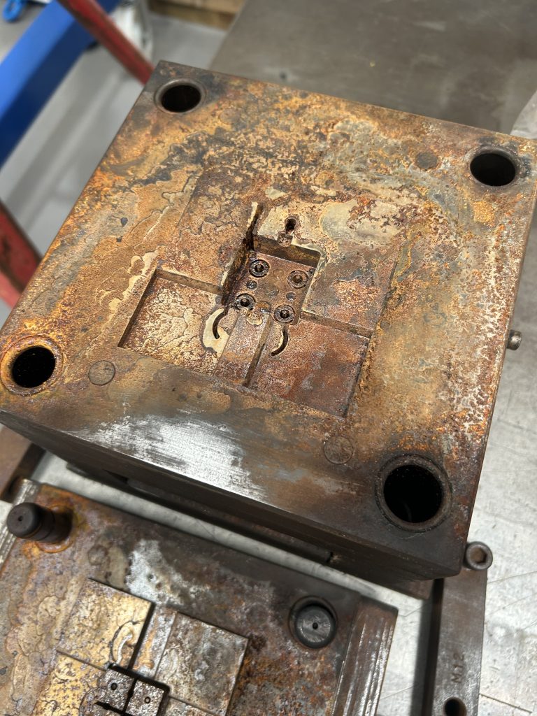 Rusted, water-damaged injection mould tool before vapour blasting restoration at Sabre Plastics Tooling